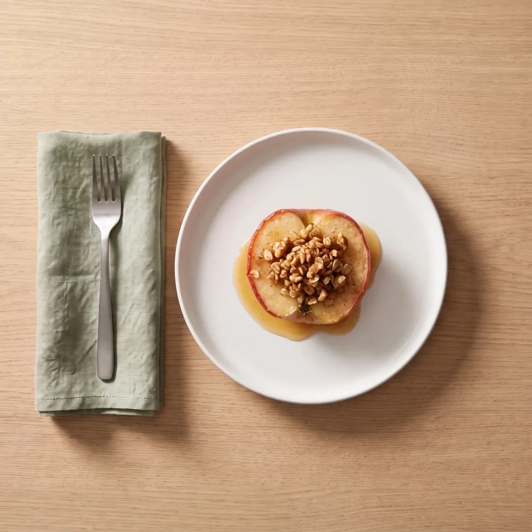 Half a baked apple with walnut oat topping