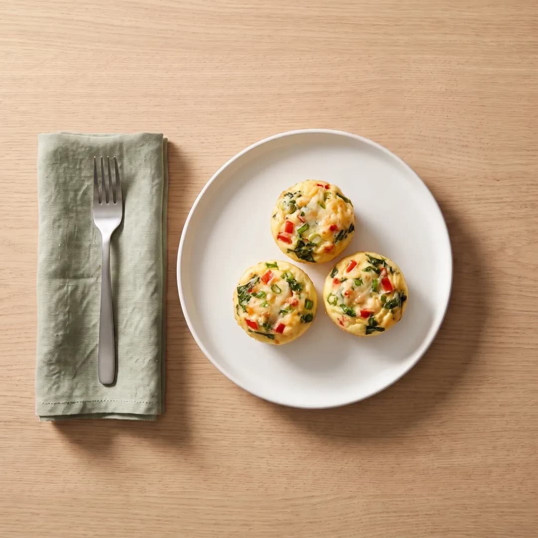Three cottage cheese egg bites on a white plate