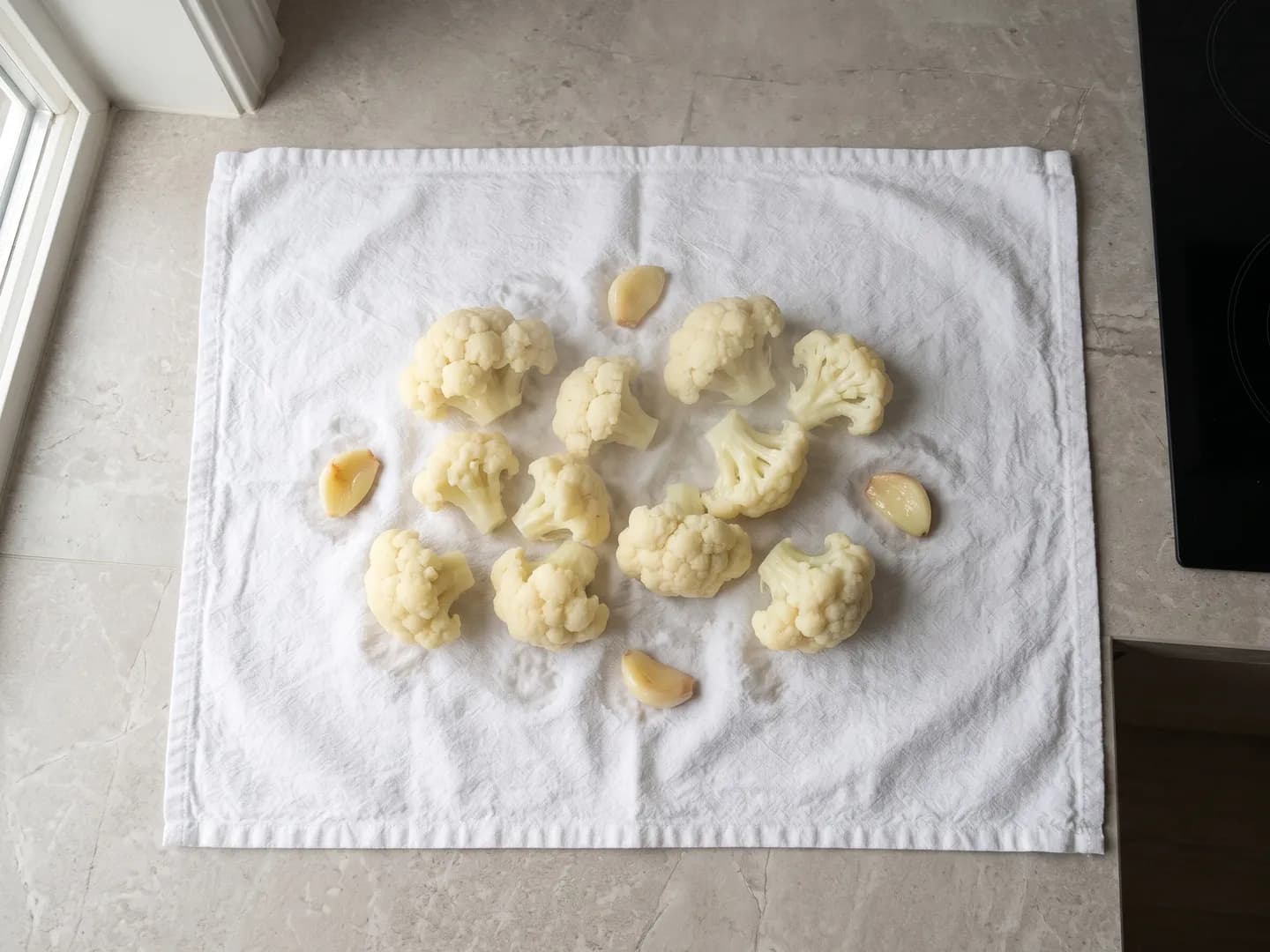 Draining steamed cauliflower on a towel