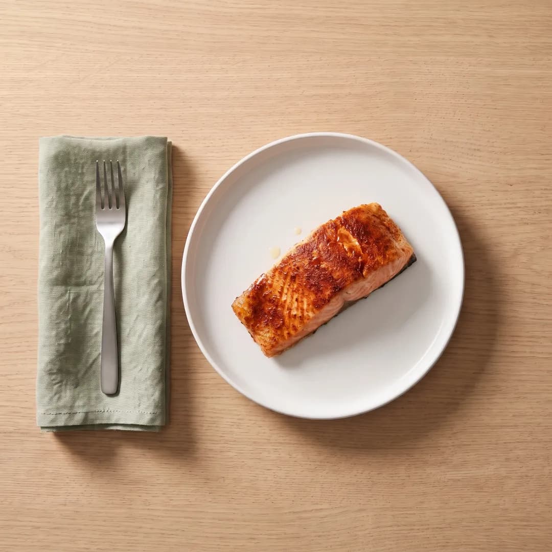 Air fryer salmon fillet on a white plate