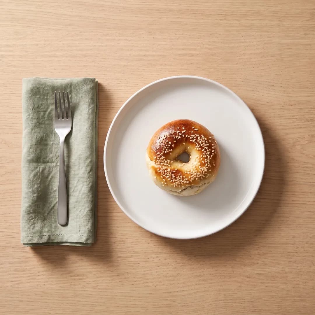 A mini Greek yogurt protein bagel with sesame seeds