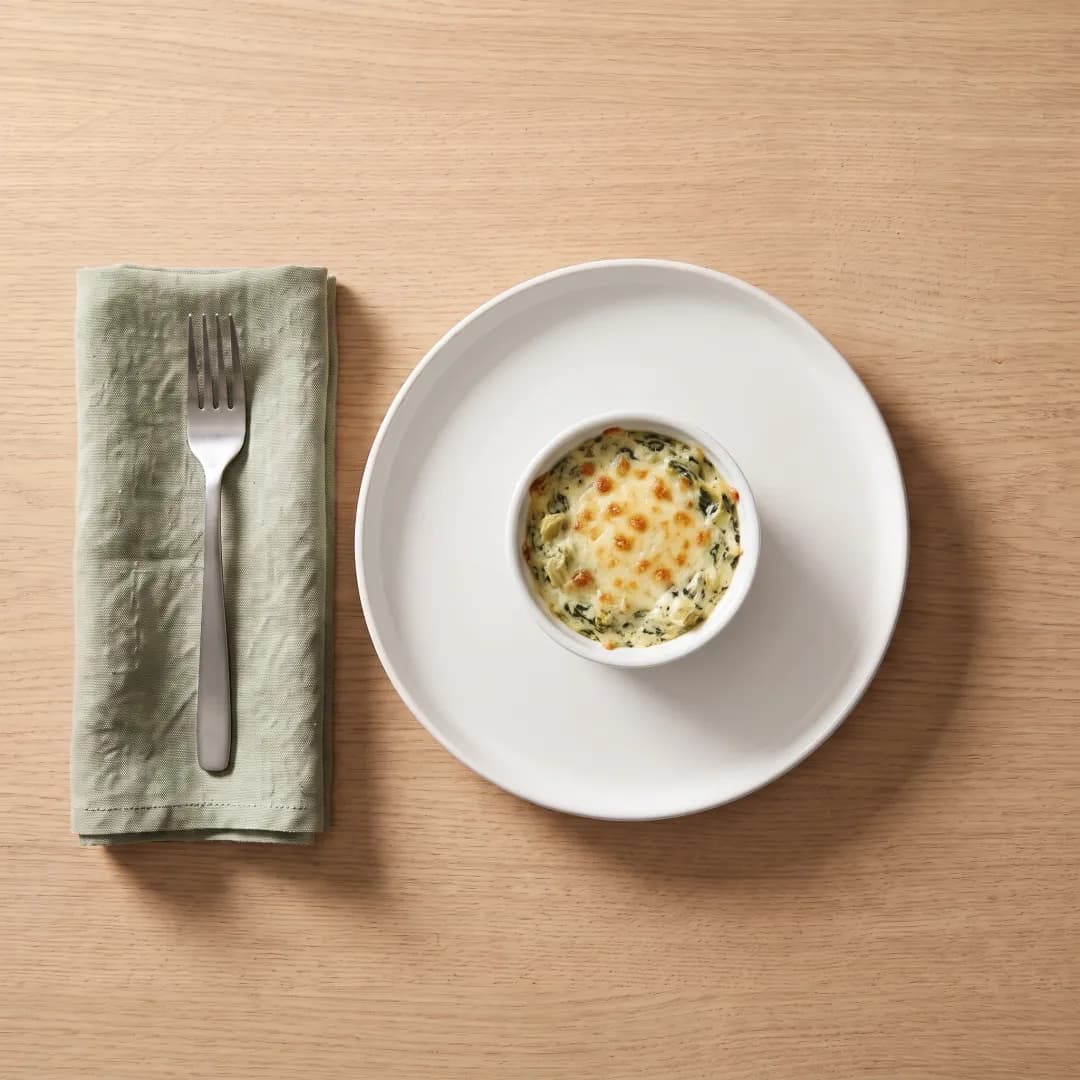 Ramekin of healthy spinach artichoke dip
