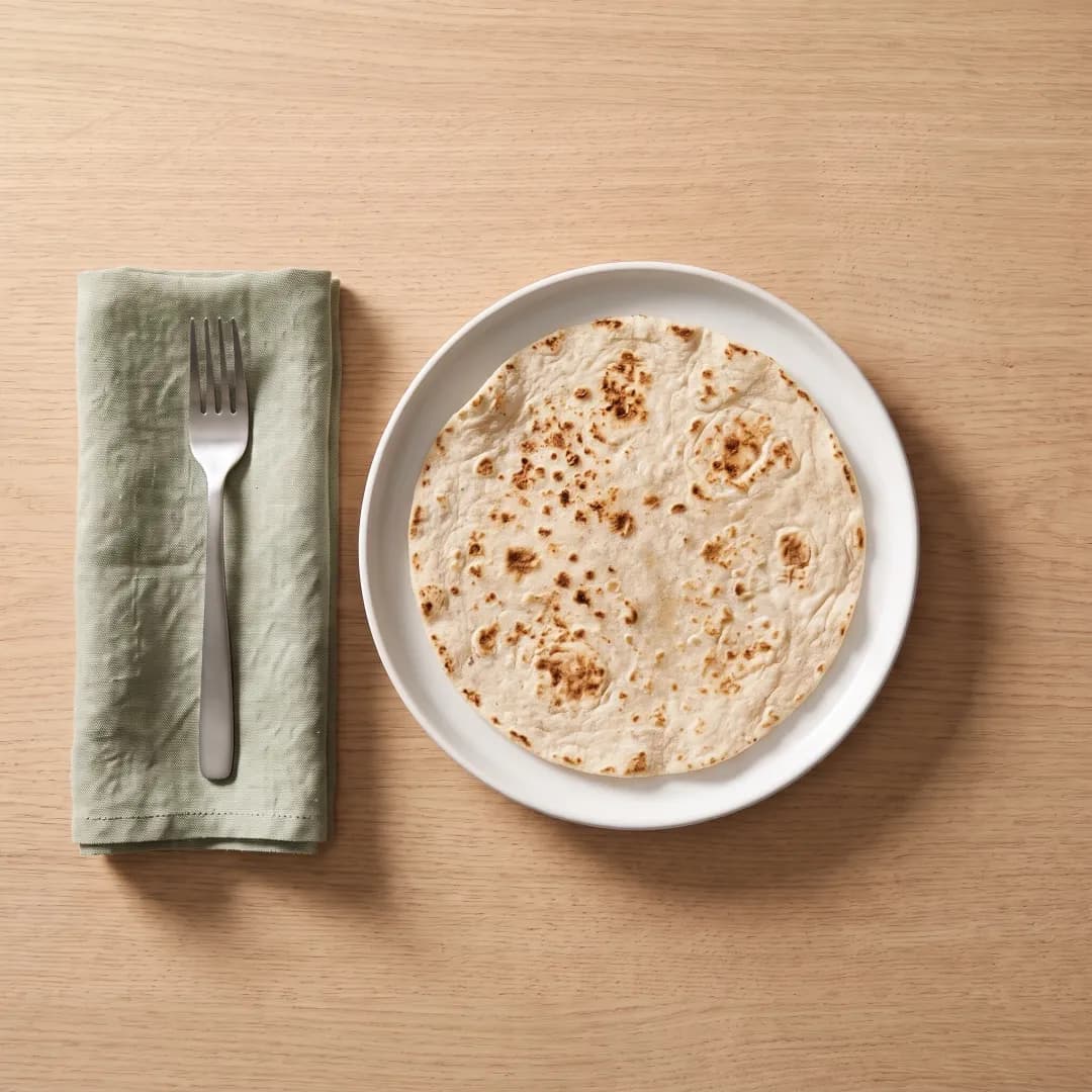 A homemade low-carb tortilla on a white plate