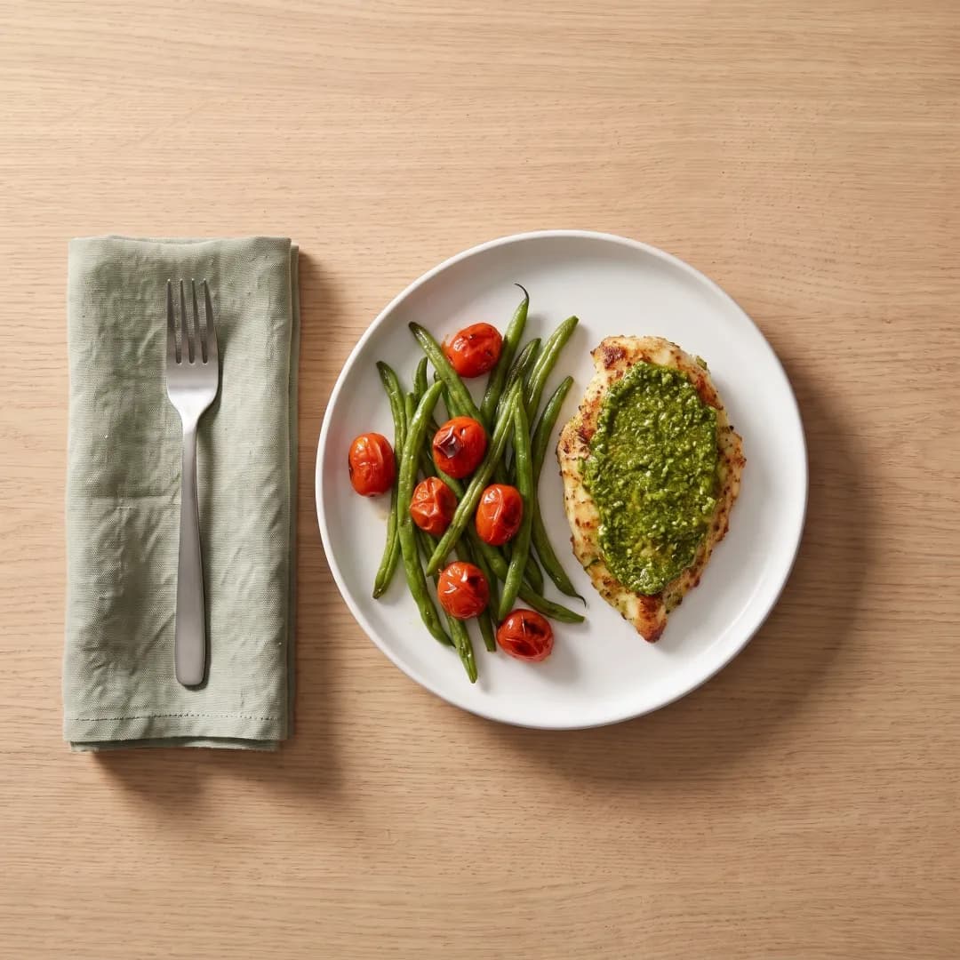 Pesto chicken with roasted green beans and tomatoes
