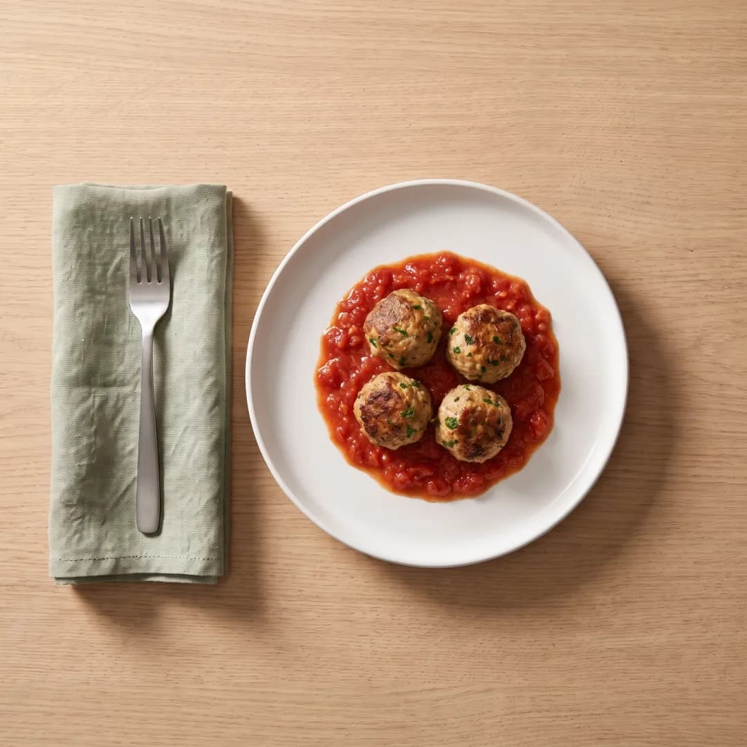 Four turkey meatballs in tomato sauce